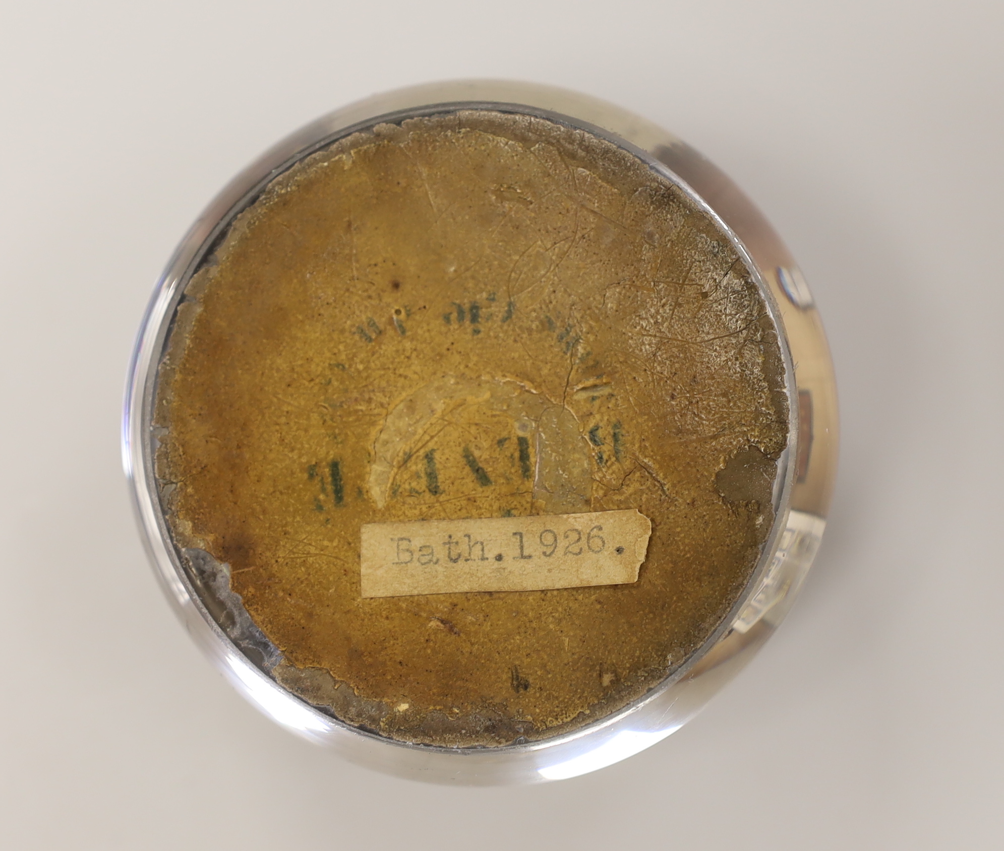 A Queen Victoria reverse decorated glass paperweight, approximately 7.5cm diameter